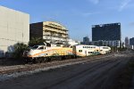 Northbound Sunrail Train # P330 passes alongside the Colonial Opas paths shortly after having departing LYNX Central Station